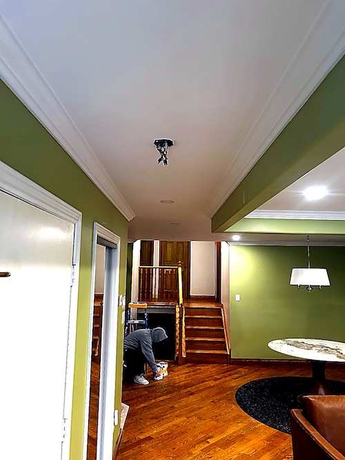 Finished smooth ceiling with pot lights in a Port Credit renovation